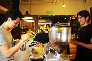 Travelling baristas Junichi Yamaguchi (left) and Masa Aoki (right) sharing a laugh. — Picture by Choo Choy May